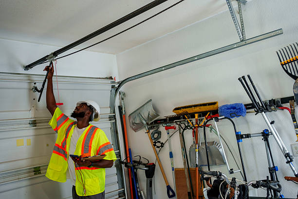 Professional Garage Door Panel Replacement technician working in Raynham Center, MA